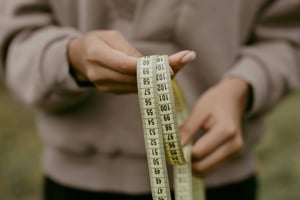 Woman holding measuring tape